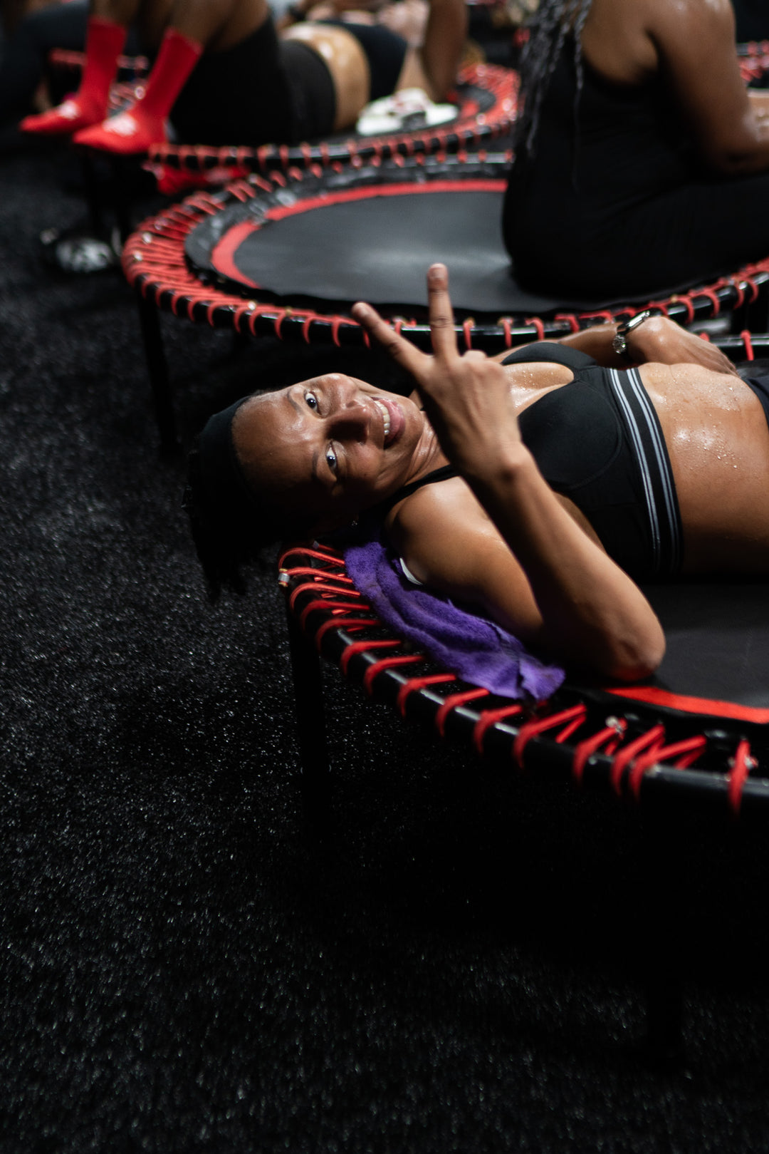 A group of people bouncing on an exercise trampoline
